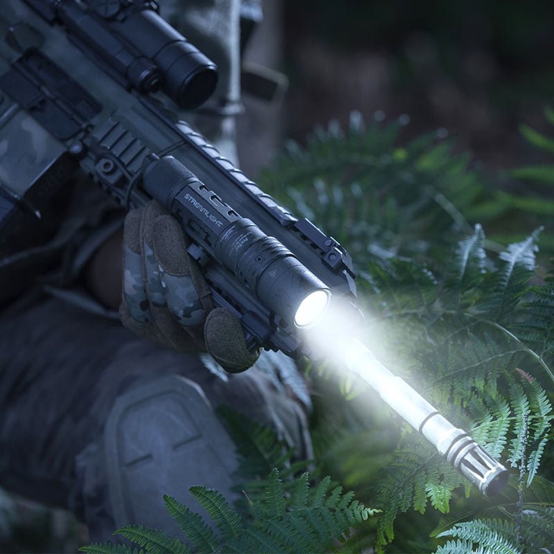 Streamlight ProTac HL-X Laser on a rifle handguard projecting a 1,000-lumen beam outdoors at night