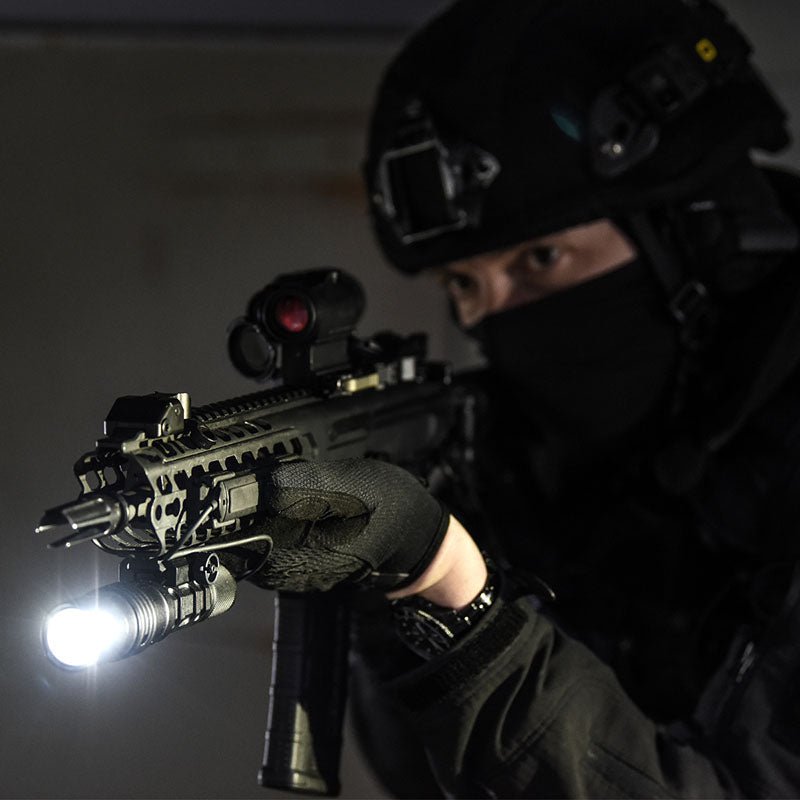 Tactical officer aiming a rifle fitted with the Streamlight ProTac Rail Mount HL-X Laser