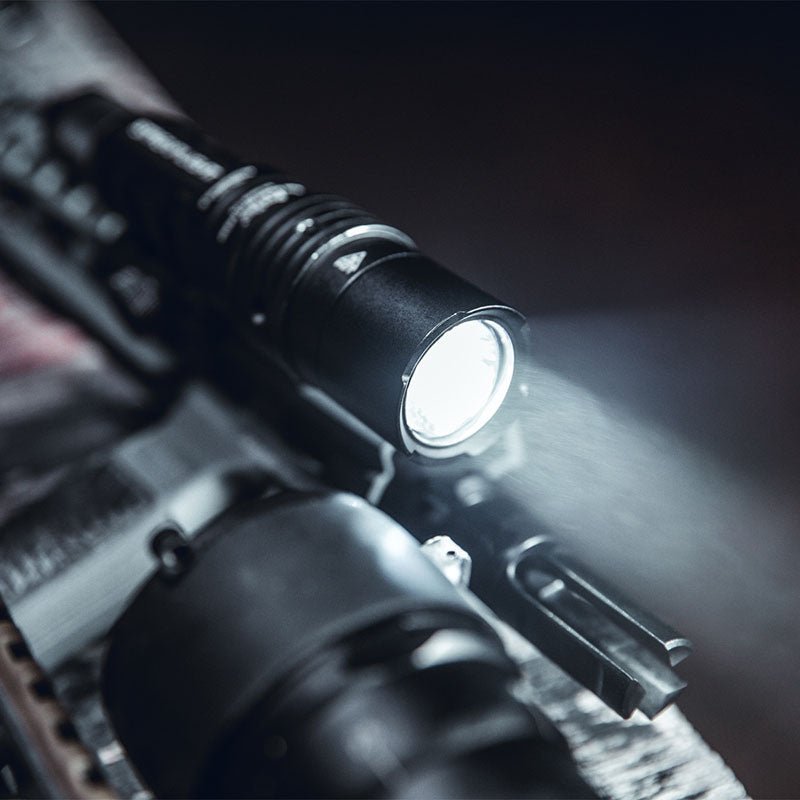 Close-up of the Streamlight ProTac HL-X Laser bezel lit on high, mounted on a rifle rail