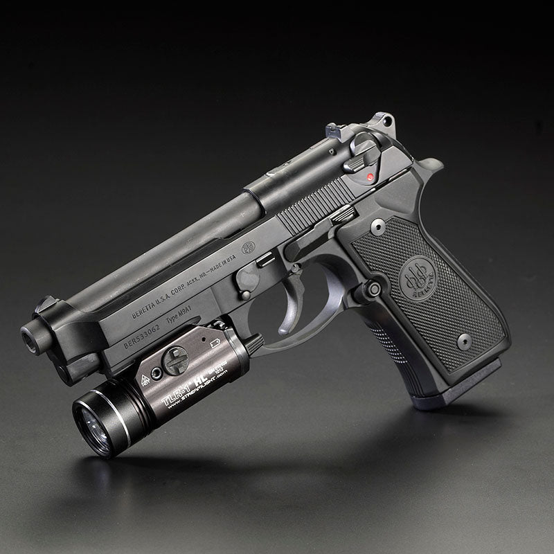 Streamlight TLR-1 HL weapon light mounted on a Beretta pistol accessory rail