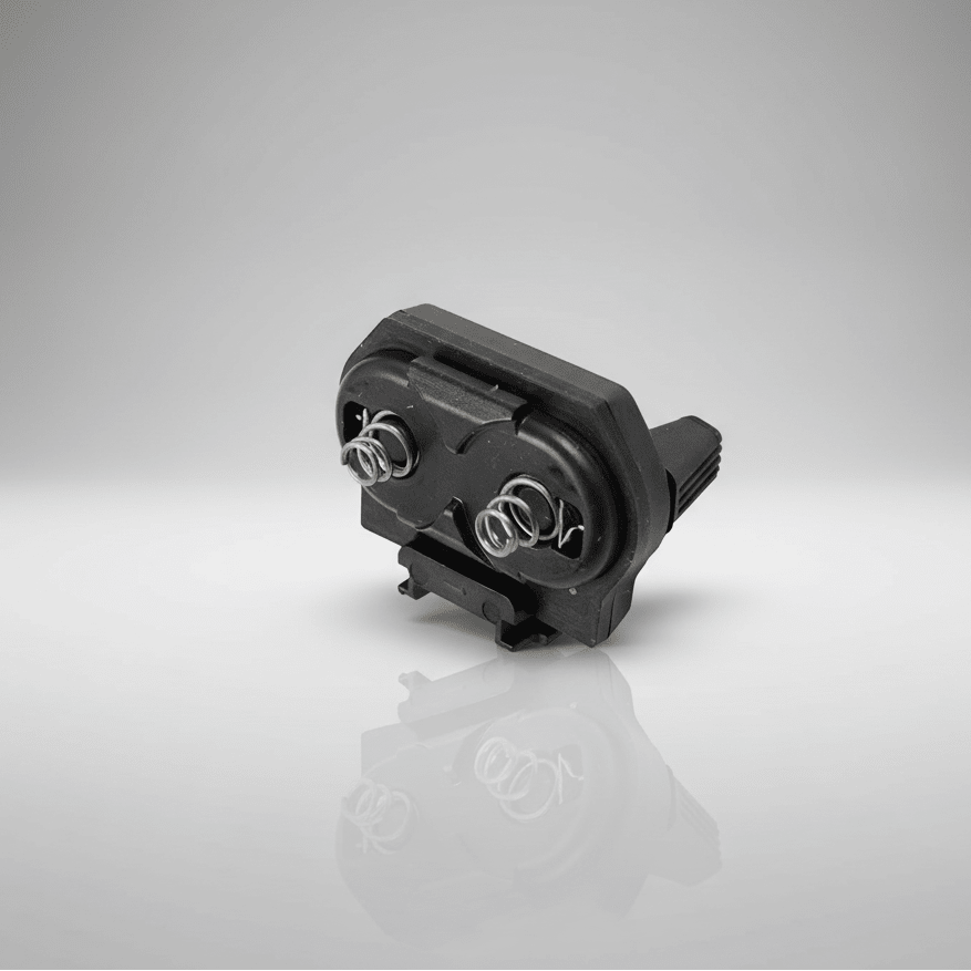 Black electronic component on a reflective gray surface with a gradient background