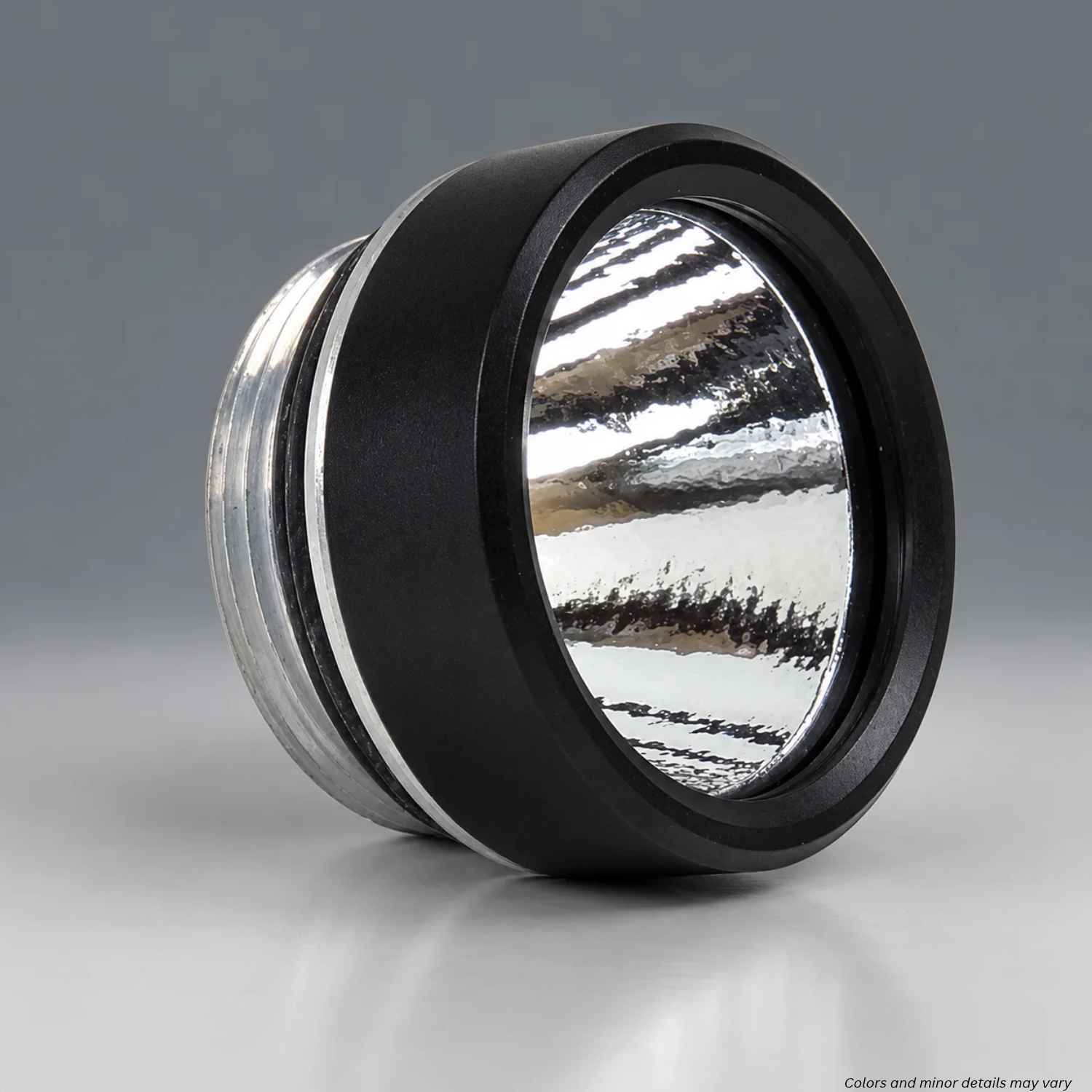 Angled side view of the Streamlight TLR facecap with black bezel and textured reflector