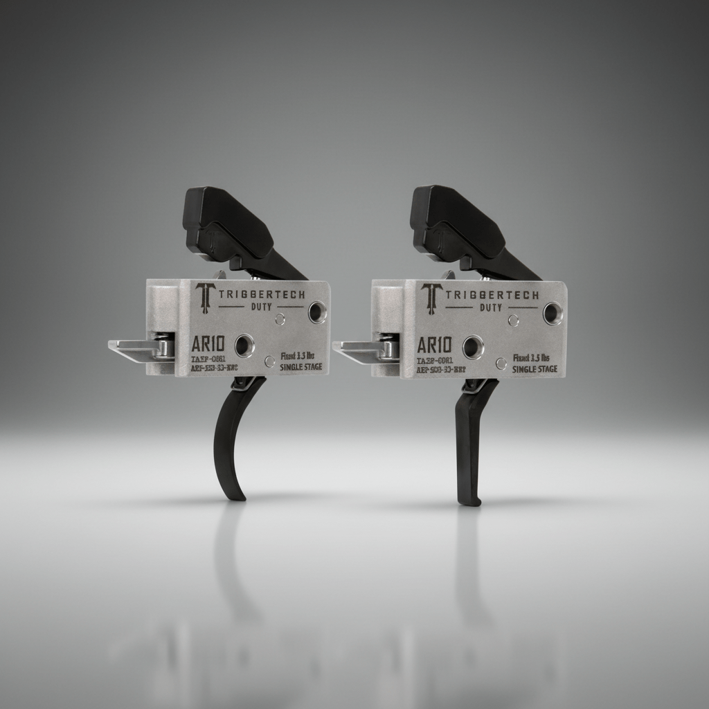 Two TriggerTech AR10 trigger mechanisms on a gray background