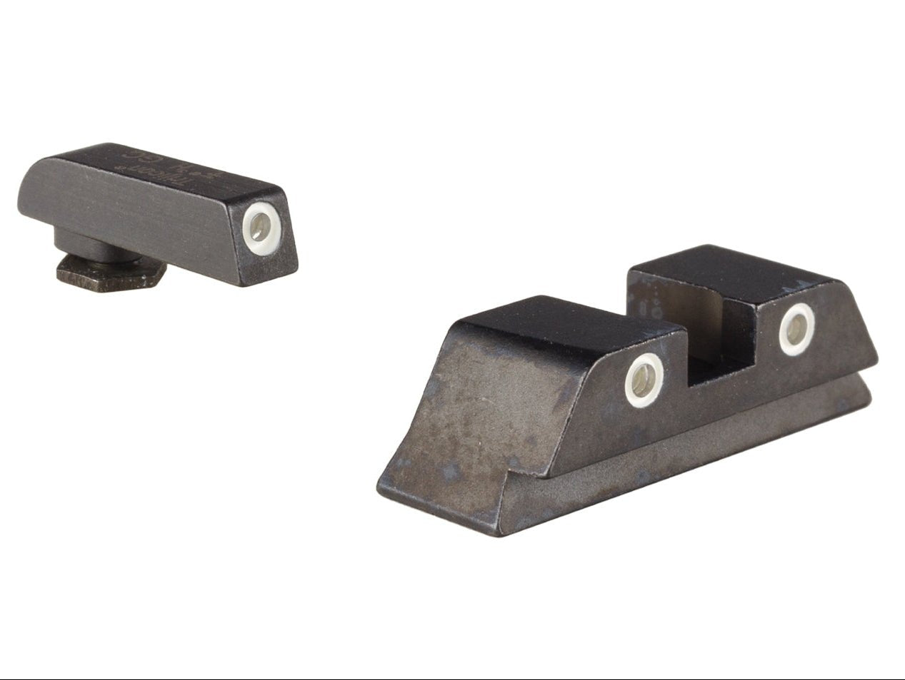 Trijicon GL01Y Glock night sights at an angle, showing white-outline tritium dots