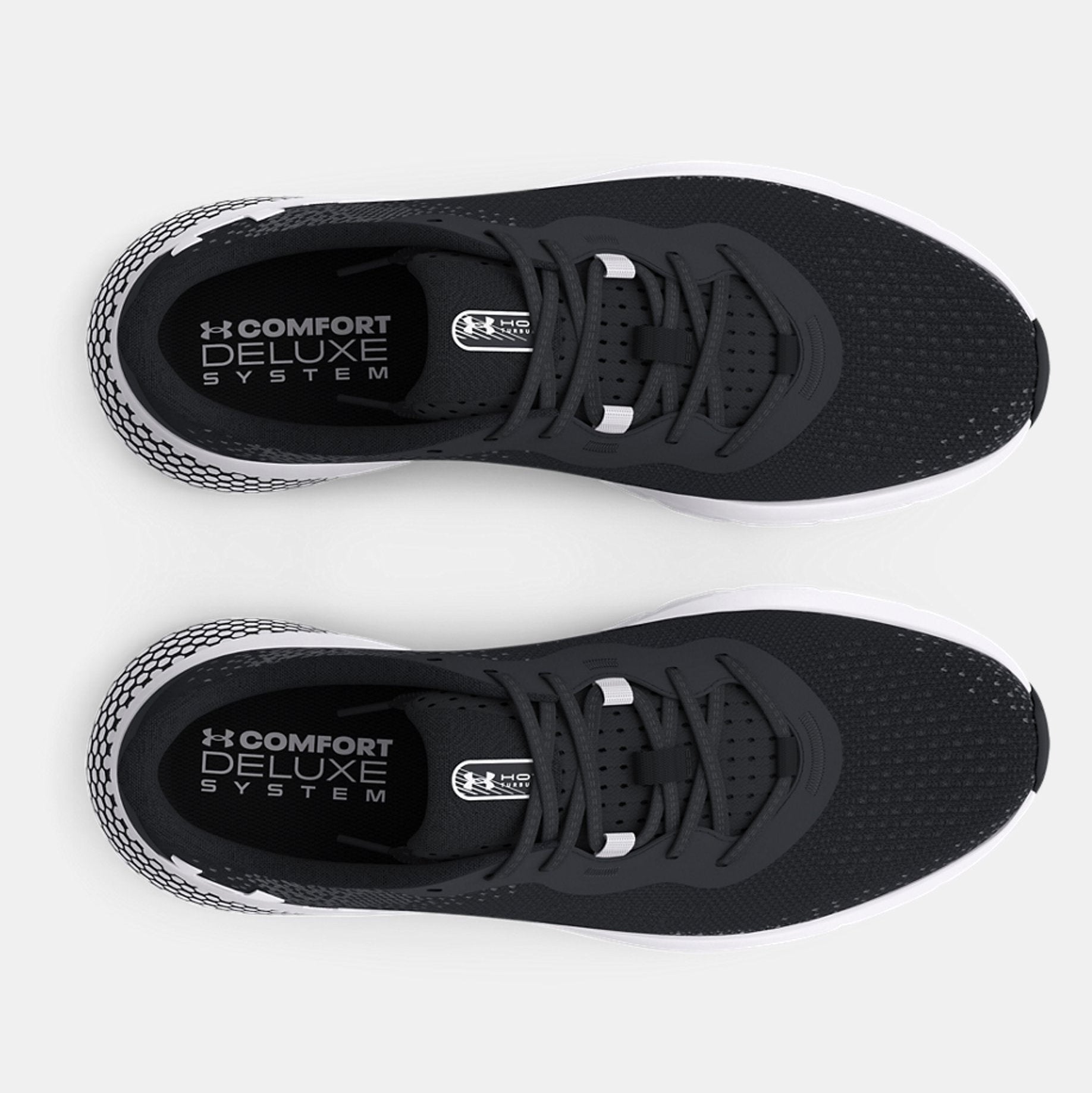 Black athletic shoes with 'Comfort Deluxe System' label on a white background