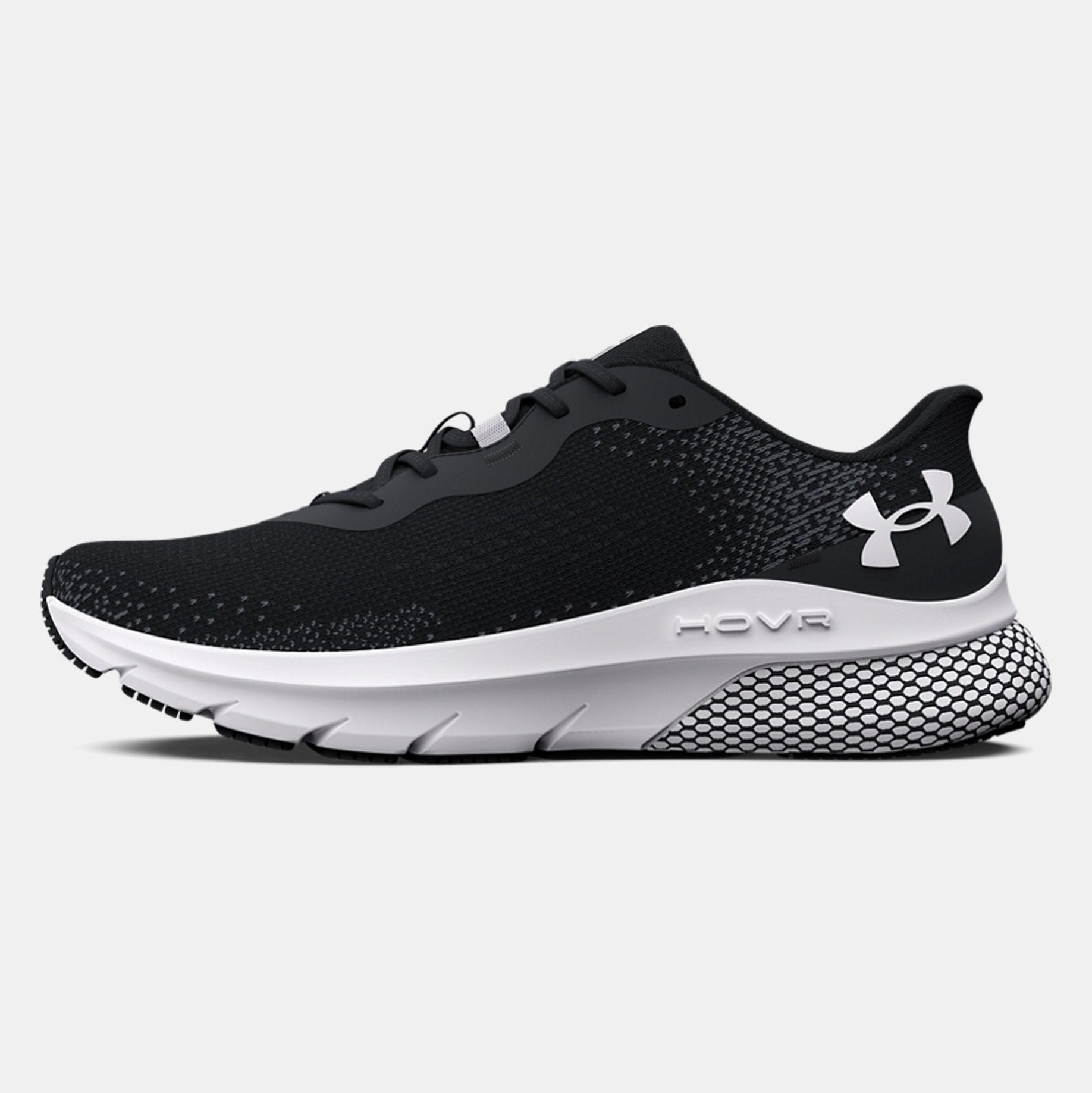Black running shoe with white sole on a light gray background