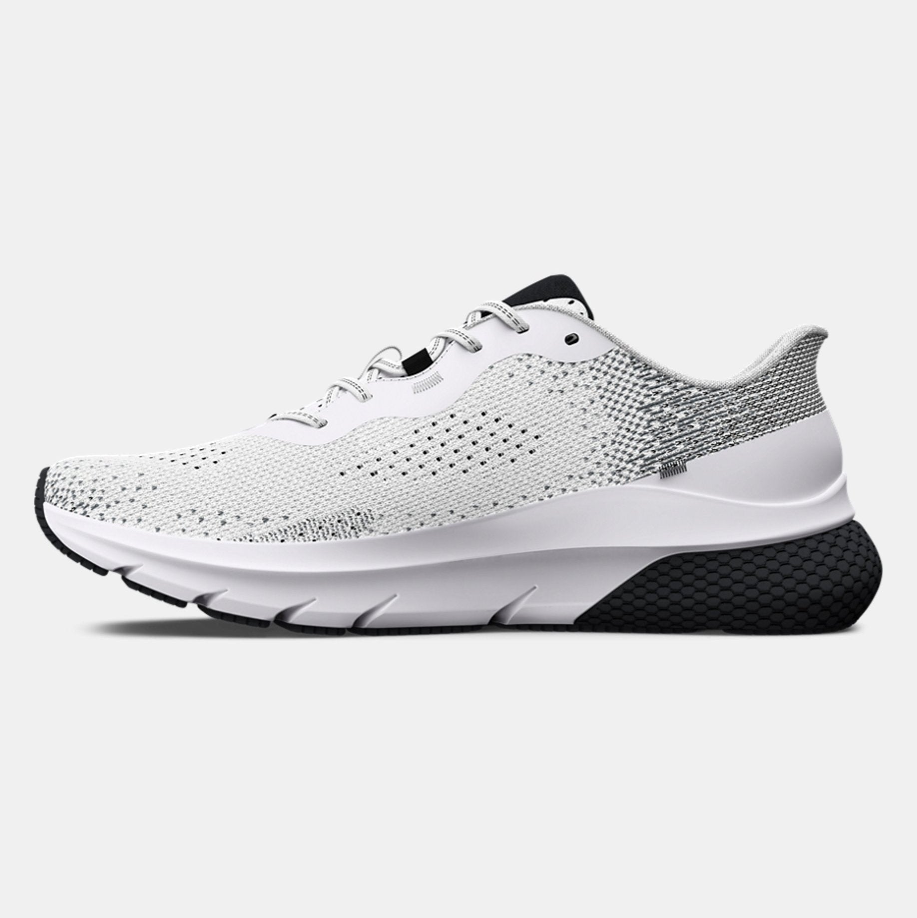White running shoe with black sole on a light gray background