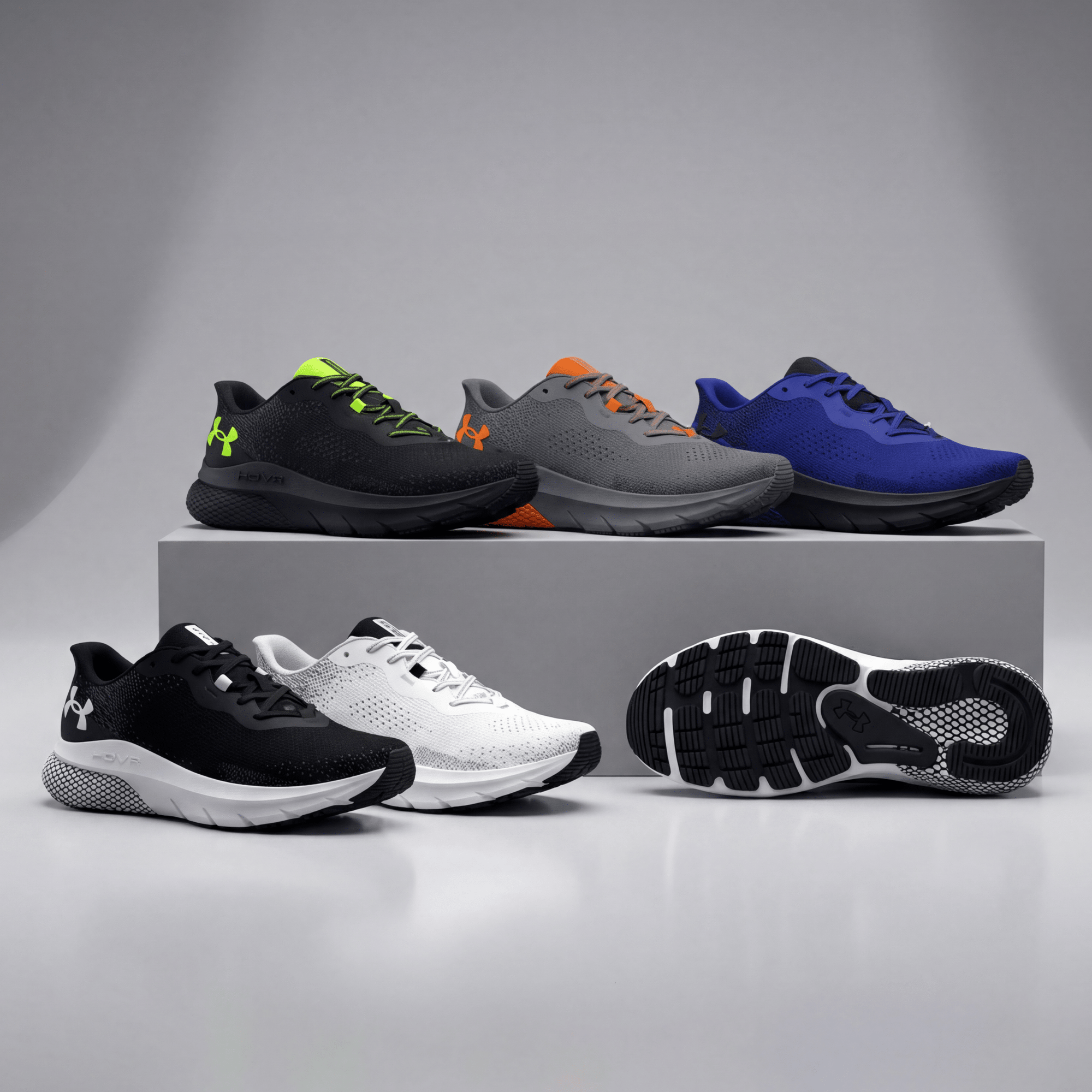 Collection of running shoes on a gray background