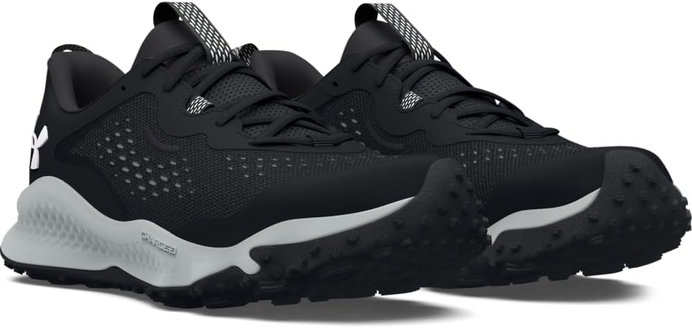 Black athletic shoes with white soles on a white background