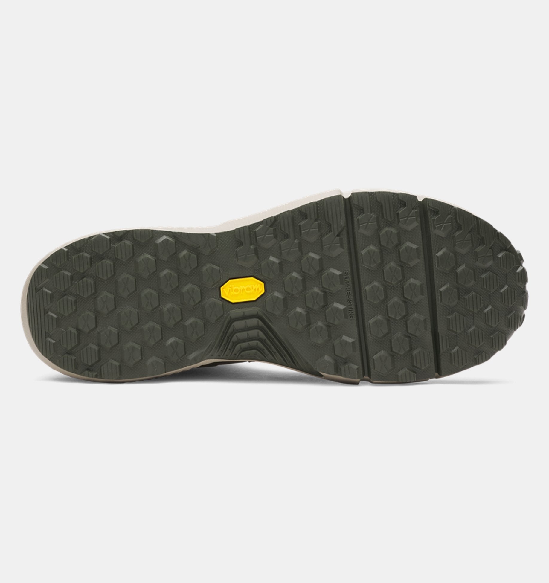 Close-up of a shoe sole with a yellow label on a light gray background