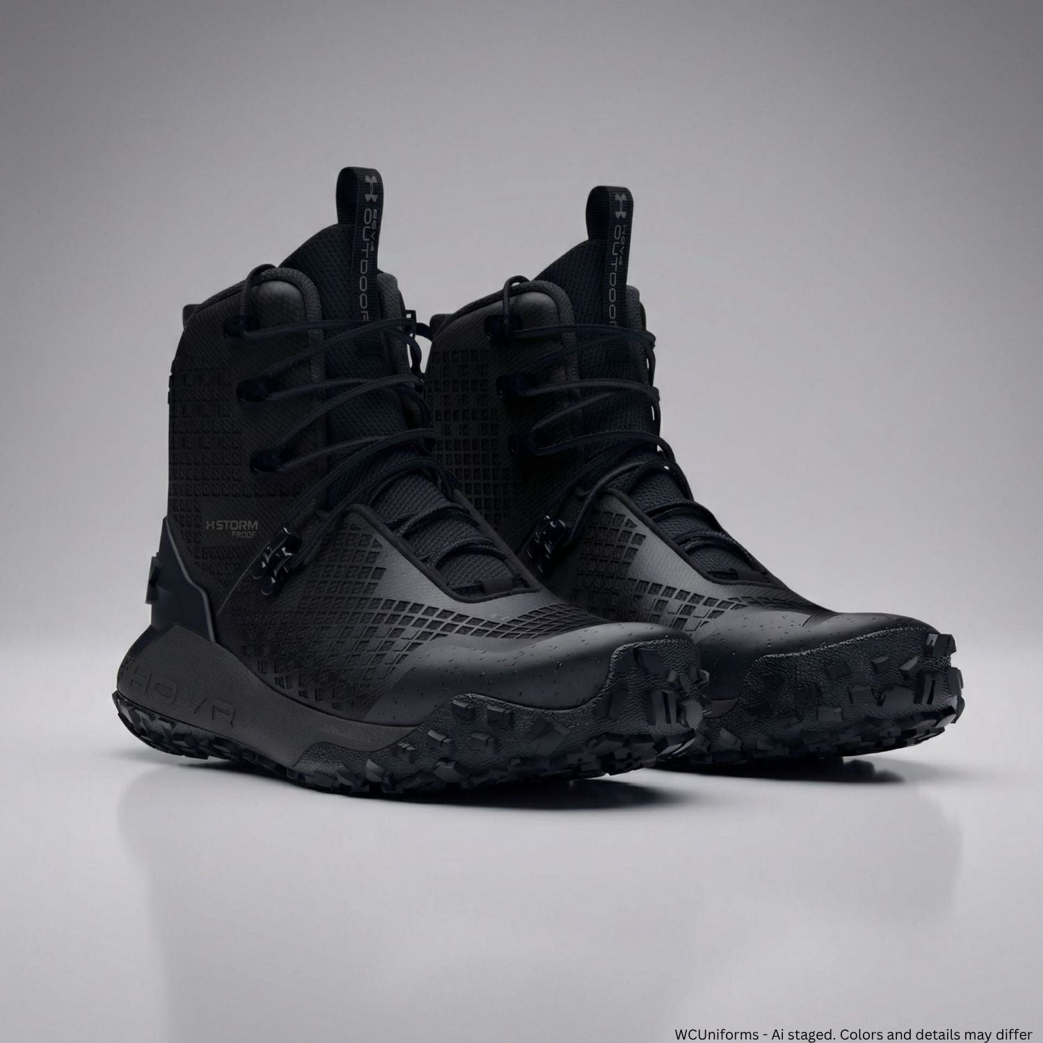 Black high-top sneakers on a gray background