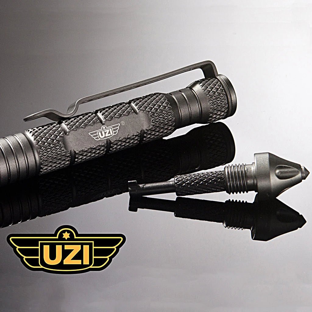 Close-up of Gun Metal Grey UZI Defender Tactical Pen #6 with glassbreaker and concealed cuff key