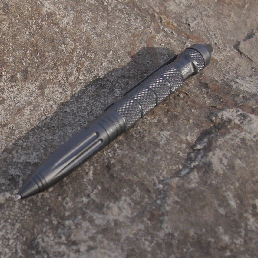 Gunmetal gray UZI Tactical Defender Pen with pocket clip and knurled grip