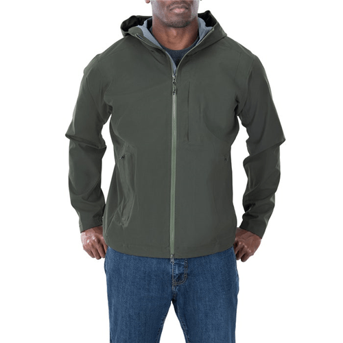 Man wearing the Vertx Fury Hardshell Jacket, showcasing its lightweight, water- and windproof design.