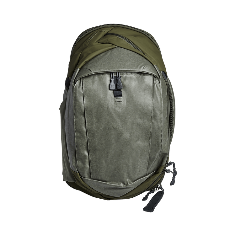 Vertx Pro Commuter backpack in green, featuring ballistic panel compatibility and hands-free sling design for active use.