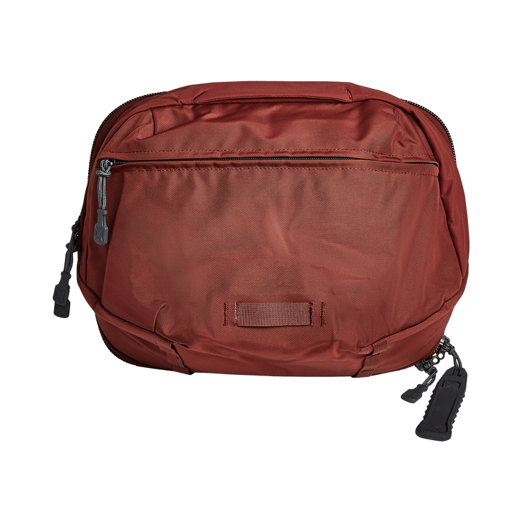 Vertx Pro Navigator bag in red, versatile design with zippered front pocket and durable fabric for outdoor adventures.