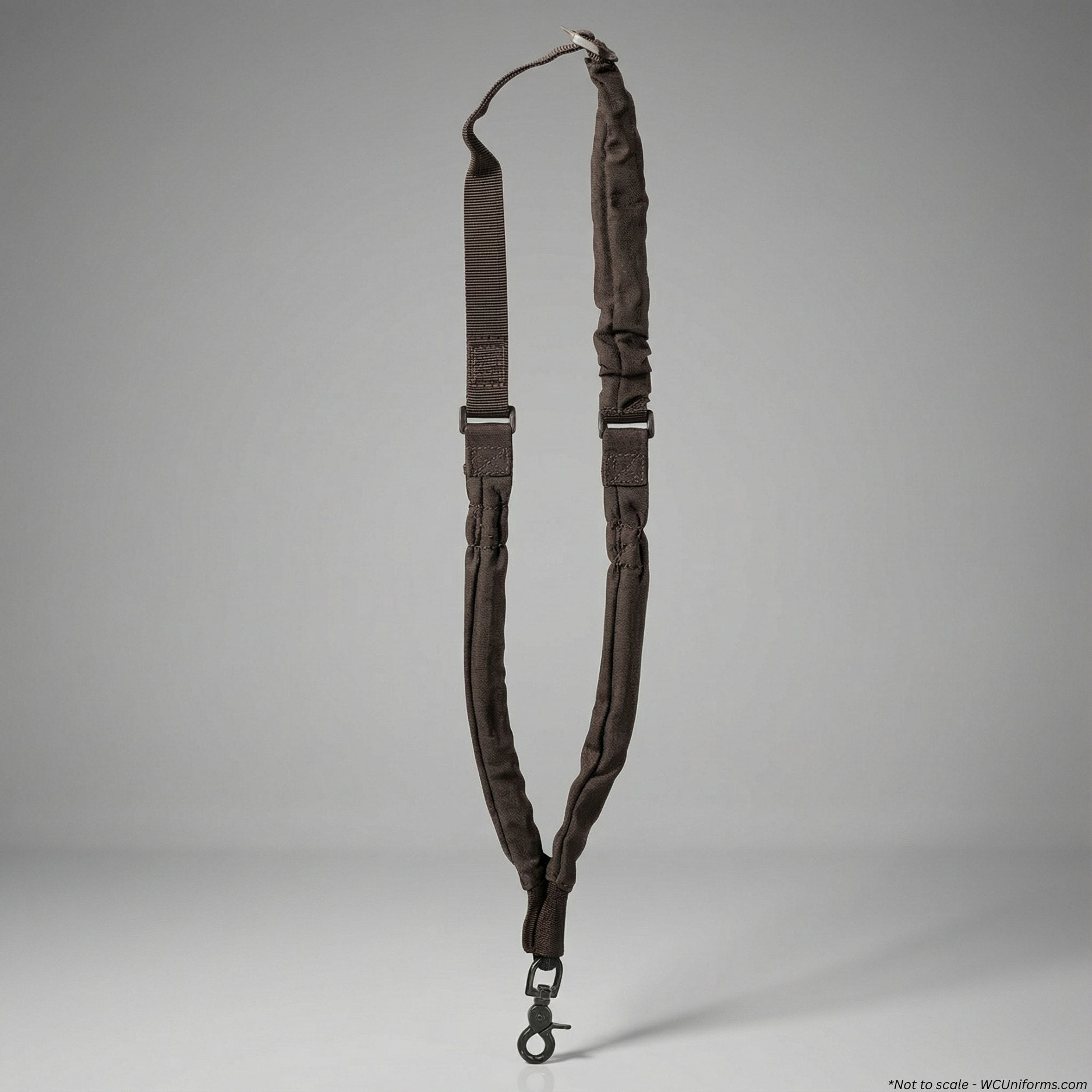 Black Voodoo Tactical Bungee Rifle Sling 20-8961 with metal hardware on a gray background