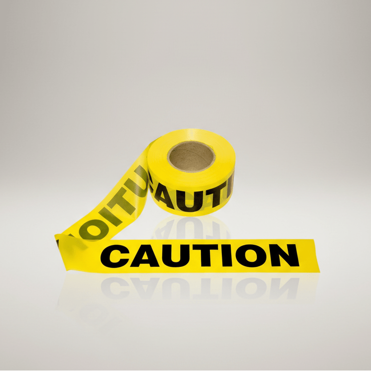 Roll of yellow caution tape with black text on a gray background