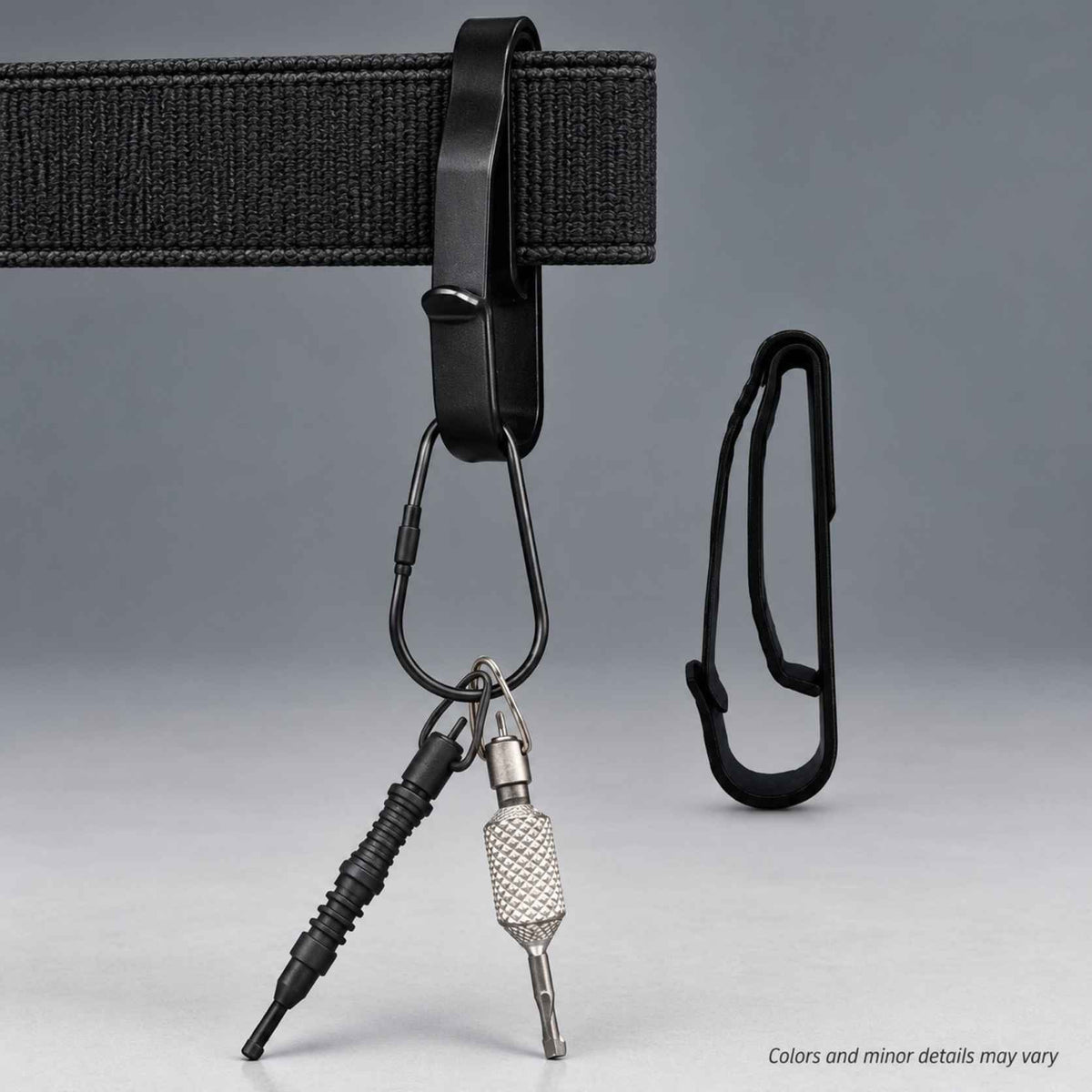 Zak Tool ZT55 tactical key ring holder mounted on a duty belt carrying handcuff keys, with a side view