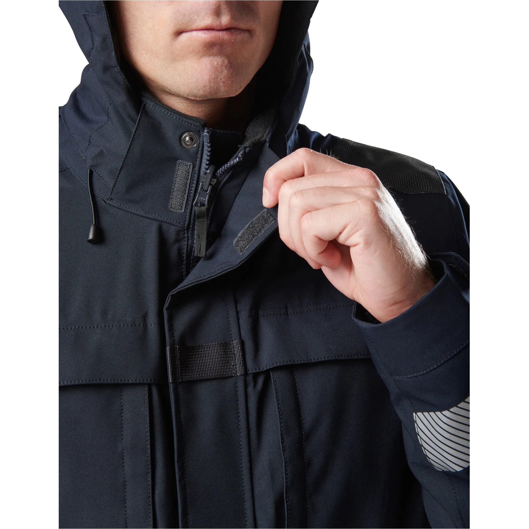 Close-up of a person wearing a 5.11 Tactical Responder Parka 2.0, showcasing the durable fabric and features.