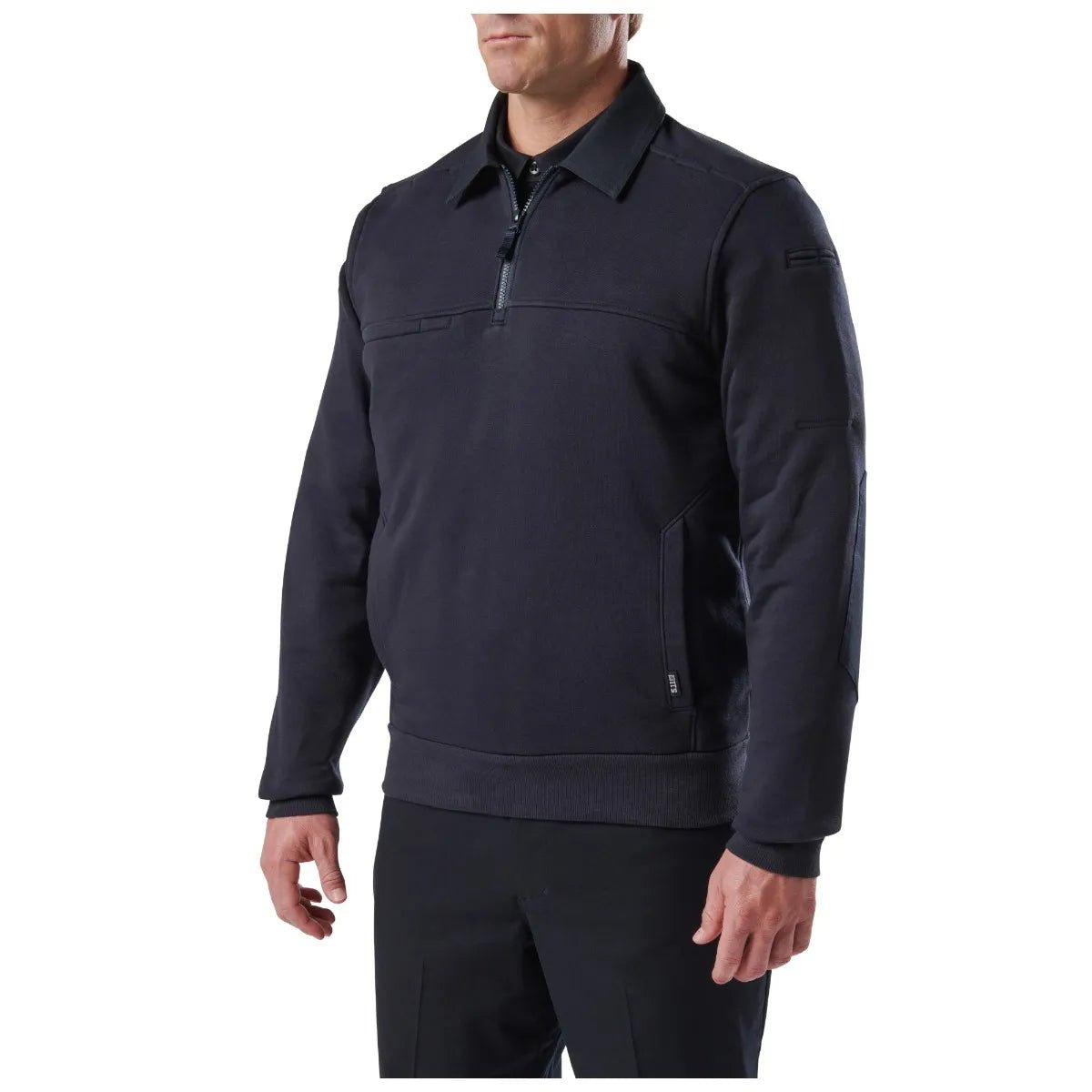 5.11 Job Shirt with Canvas 2.0 in Fire Navy worn over a black uniform shirt and duty pants