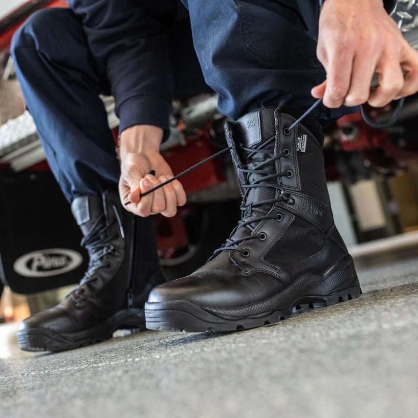 Close-up of a person lacing 5.11 Tactical A.T.A.C.® 2.0 8" Storm Side-Zip Boots for optimal fit and performance.