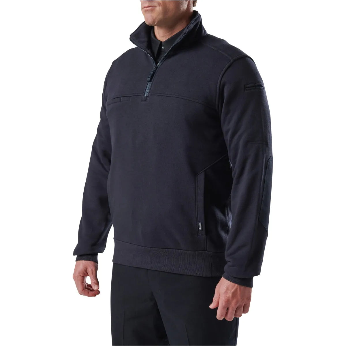 Man wearing 5.11 Tactical Job Shirt 1/4 Zip 2.0 in black, showcasing durable design and practical pockets for utility.