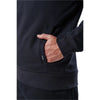 Close-up of a person wearing a 5.11 Tactical Job Shirt 1/4 Zip 2.0, showcasing the hand pocket detail and durable fabric.