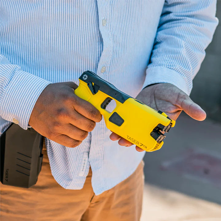 Man holding a TASER 7 CQ Home Defense – 12‑Foot range double‑shot stun device with laser and contact‑stun mode 20285 - Taser CEW's