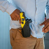 Man holstering a TASER 7 CQ Home Defense – 12‑Foot range double‑shot stun device with laser and contact‑stun mode 20285 - Taser CEW's