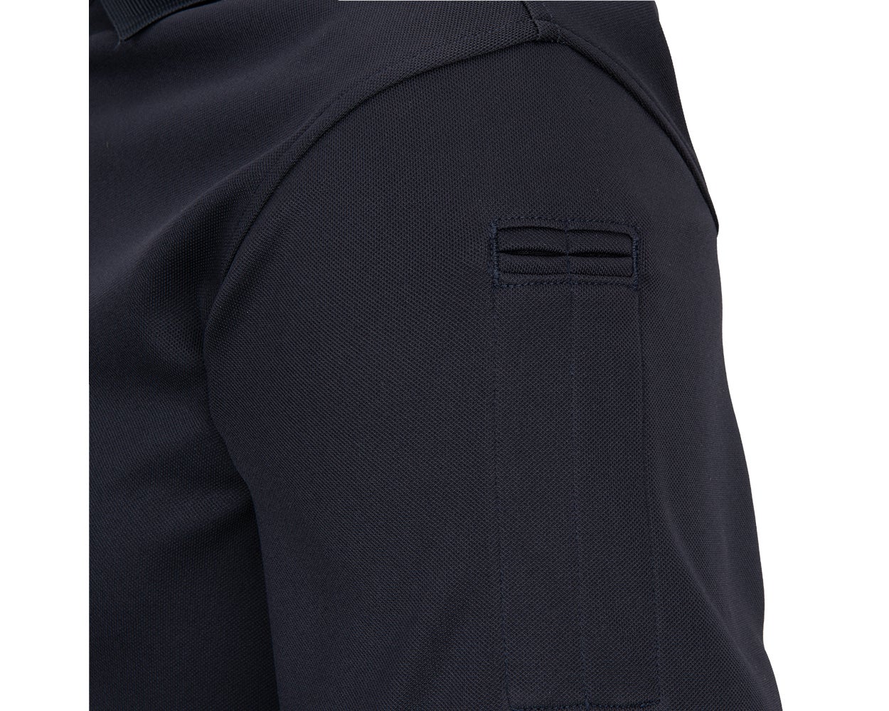Hidden pen pocket on the sleeve of the Flying Cross Impact Polo