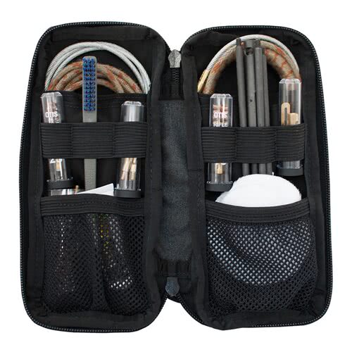 Otis Technology Defender Series gun cleaning kit accessories, brushes, patches, and cable laid out